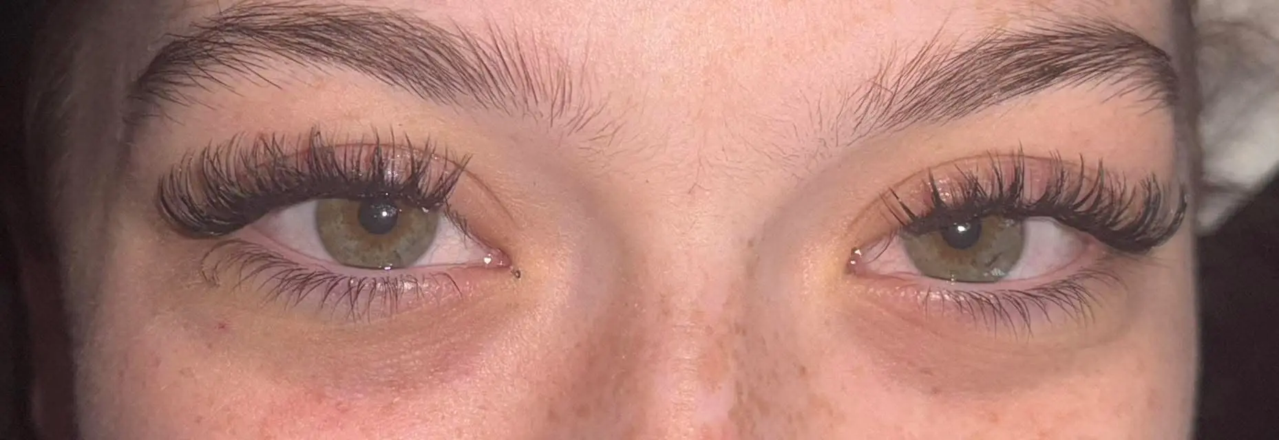 Both eyes with natural cluster lash set showing full volume