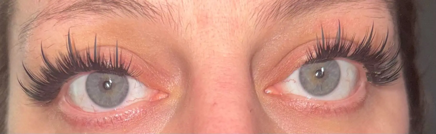 Close-up of both eyes with natural volume cluster lash set